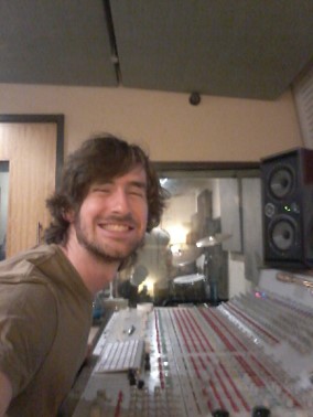 Photo shows David Lauritsen in front of studio mixing console