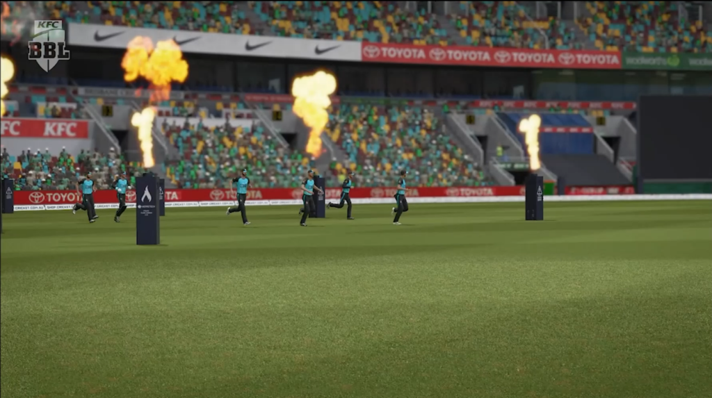 Screenshot from game Cricket24 showing players coming onto the pitch with flame jets.