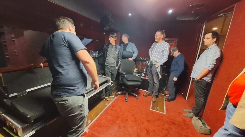 Nick Walker with the visitors in the empty audio control room
