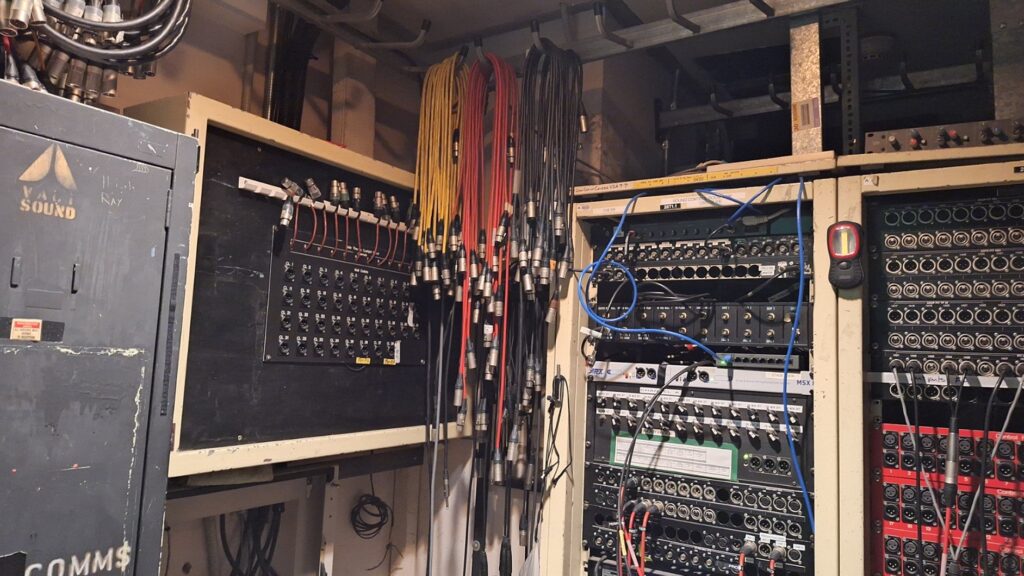 Photos of XLR panels for audio in/outs and cue light system patching