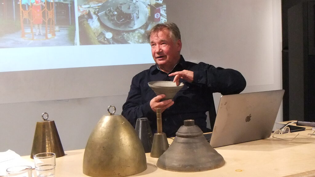Photo of Anton holding a CSIRO 3D printed titanium bell