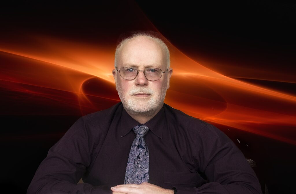 Photo of Graeme Huon against a plasma effect background