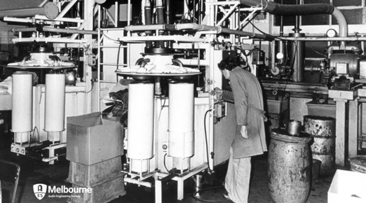 Black and white photo of cone assembly in loudspeaker factory