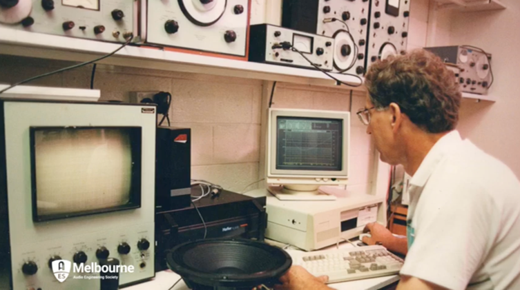 A photo of Michail in his laboratory making measurements on a loudspeaker