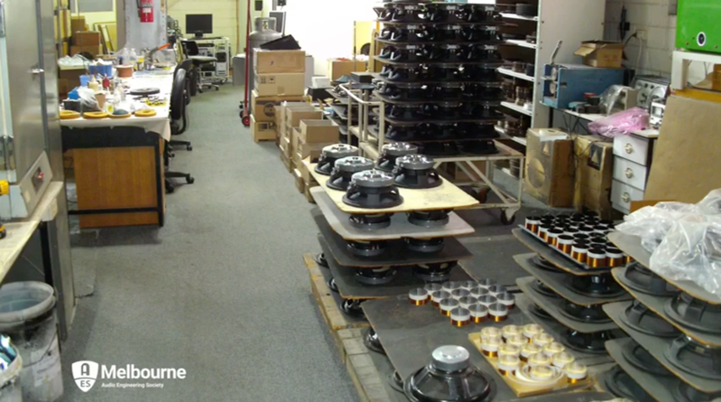 A photo of the Lorantz factory floor, displaying a large number of loudspeaker cones awaiting assembly into low frequency drivers.