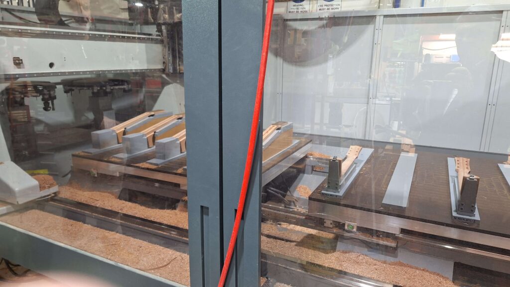 Photo of a 5-axis CNC Machine makes a complete guitar neck in a single pass